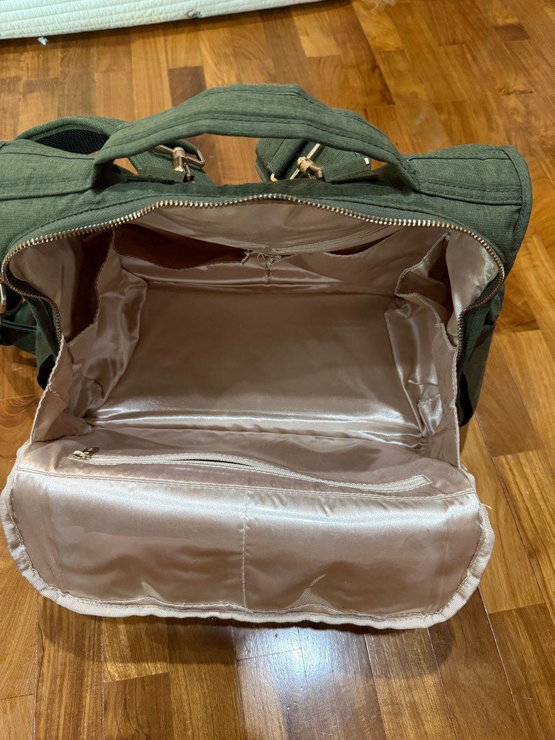 Jujube BFF Olive Green FREE DELIVERY (Category: Diaper Bags & Wetbags) located in Singapore. Submitted by summercranberries (Listing ID 1373819022, Image 2). Description: Not a mini! It’s the real sized BFF Well maintained, all zippers still working well. No stains. Gold hardware + anti microbial lining Comes with : (BRAND NEW)Never used JUJUBE Changing mat of the same set Free tracked delivery OR will be delivered to you by hand .