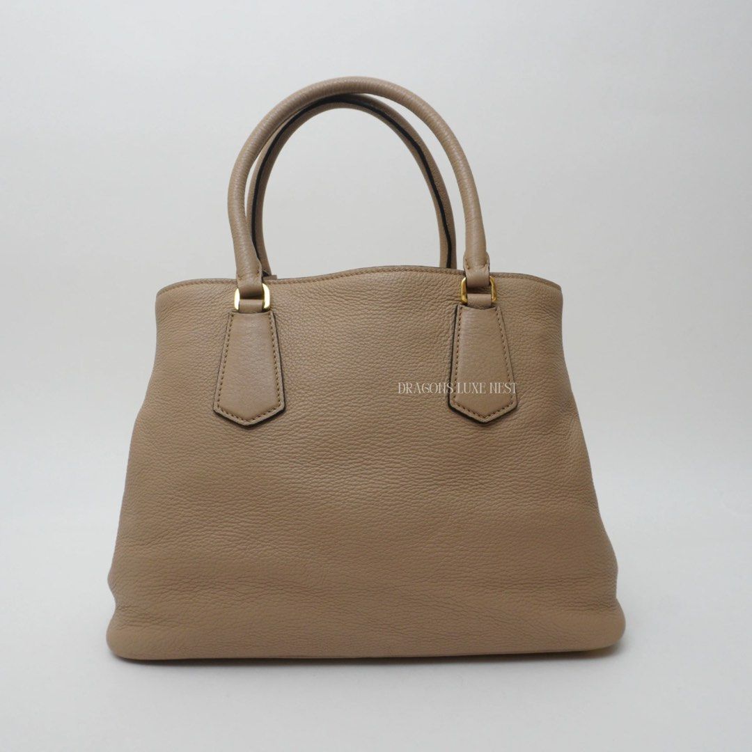 Prada Vitello Phenix Double Tote Bag (Category: Luxury Bags & Wallets) located in Taguig. Submitted by dluxenest (Listing ID 1373786508, Image 3). Description: Last price posted Inclusions: dust bag, authenticity card, guarantee card, care booklet You may follow us on IG : dluxenest FB : Dragons Luxe Nest.