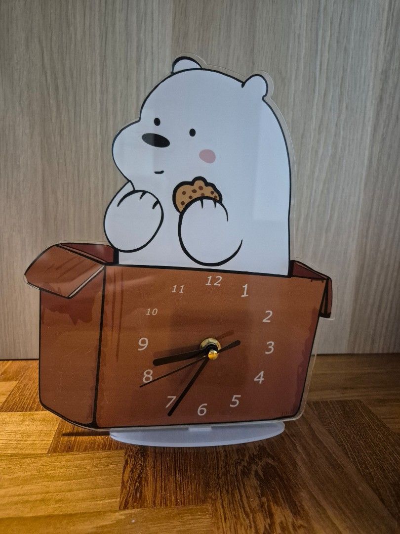 We Bare Bears Table Clock (Category: Clocks) located in Singapore. Submitted by dawgggggg (Listing ID 1373941813, Image 1). Description: dimensions: 20cm(L) by 25cm(H) numbers 10 and 11 seem smaller in size (see pic3) , not sure if its a defect or on purpose, but otherwise its all good for usage rfs: size is too small for my preference and i prefer wall clock.