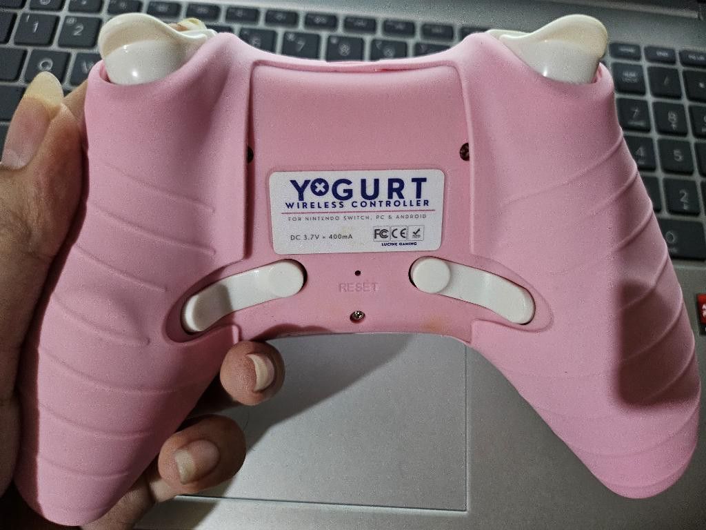 Yoghurt Gaming Wireless Pink Controller (Category: Controllers) located in Quezon City. Submitted by benpiko (Listing ID 1373808612, Image 2). Description: Pink wireless controller, already with attached joystick grip and silicone cover (also pink). Inclusions: controller and cable only Only used with my switch v2 and switch lite, but can also be used for pc and mobile devices. Only for lalamove or grab express shipping..
