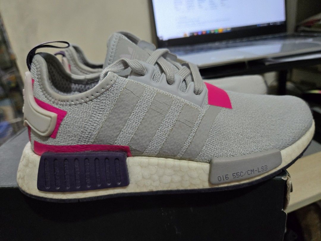 Adidas NMD R1 Womens US5.5 (Category: Sneakers) located in Quezon City. Submitted by karlleseshops (Listing ID 1378049749, Image 2). Description: ADIDAS WOMENS NMD R1 WOMENS orig. with box bought abroad for P9k. size 5.5 womens US / UK 4 Color: light gray with purple and hot link accents Used only 4x. stored for a long time. almost looks like new but looks stored for so long issue: expired glue. kayo na magpa glue. I can refer you sa gagawa na di