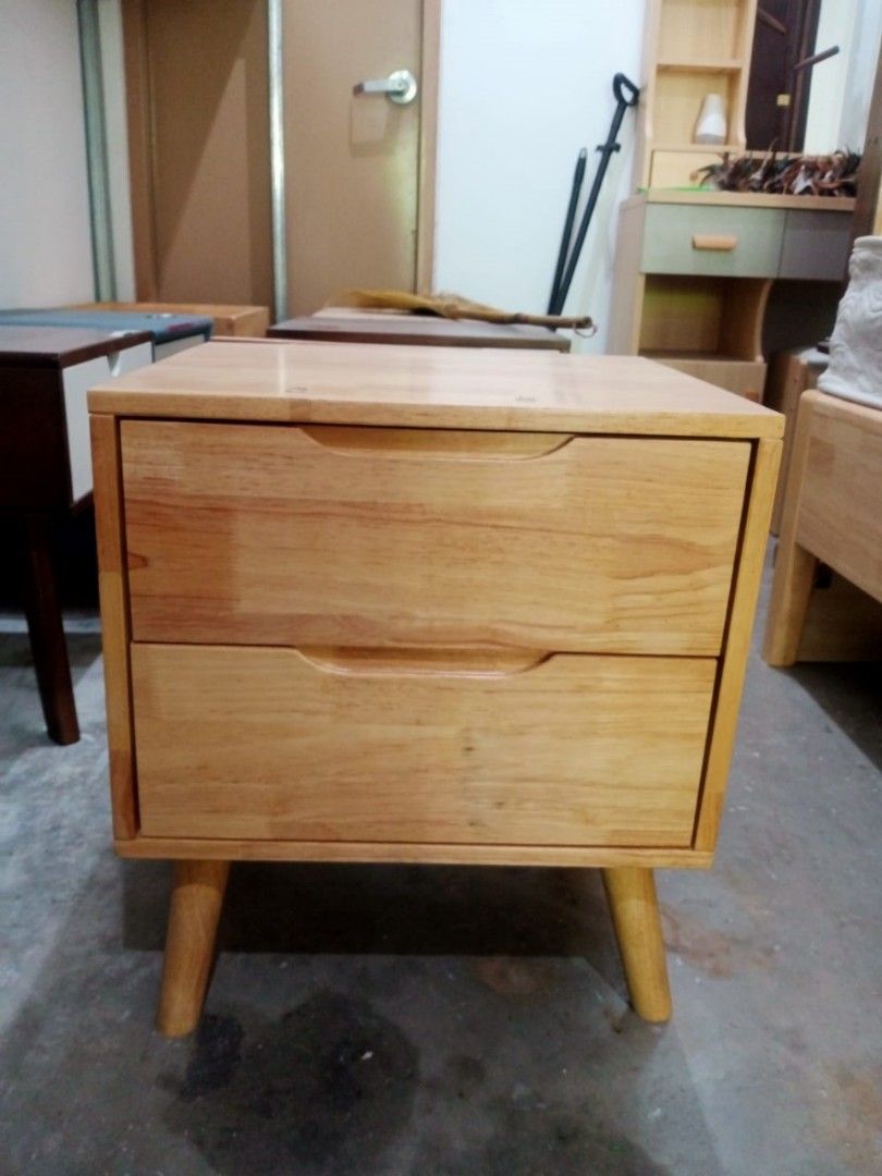 bedside table (Category: Tables & Sets) located in Manila. Submitted by kaden_chicvista (Listing ID 1378022508, Image 1). Description: solid Thailand Rubber wood with minimal flaws warehouse sale pm me we have more products. # Key Features 1. Durable construction: Solid Thailand rubberwood for longevity. 2. Ample storage: Multiple drawers for organizing personal items. 3. Space-saving design: Compact size ideal for bedrooms. 4. Natural aesthetic: