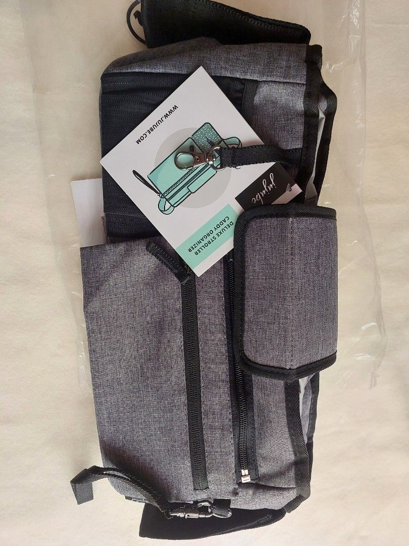 BNew Jujube Deluxe Stroller Organizer (Category: Other Babies Going Out Needs) located in Bacoor. Submitted by sorinmarkov (Listing ID 1377985668, Image 3). Description: BNew Jujube Deluxe Stroller Organizer No issues Dimension: 33 x16 x 11cm RFS: need funds MOP: Gcash, BPI Courier: LBC.
