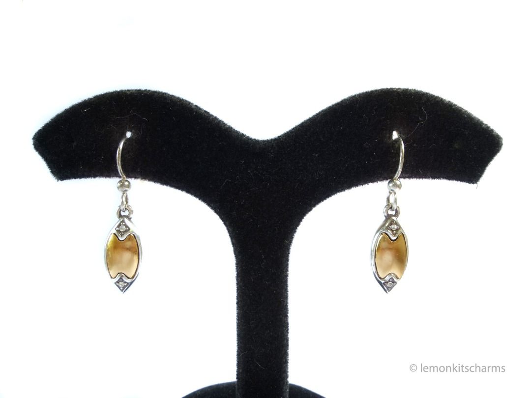 Brighton Two-tone Navette Dangle Earrings, er2668-ci (Category: Earrings) located in Singapore. Submitted by lemonkitscharms (Listing ID 1378138232, Image 2). Description: Brighton Two-tone Navette Dangle Earrings, hooks for pierced ears. Unsigned, not sure how old these are, guessing 1990s - 2000s. Good condition, slight aging and scuffs on surface. Both sides have the same design. Satin finish goldtone middle and silvertone edges. There are 2 r