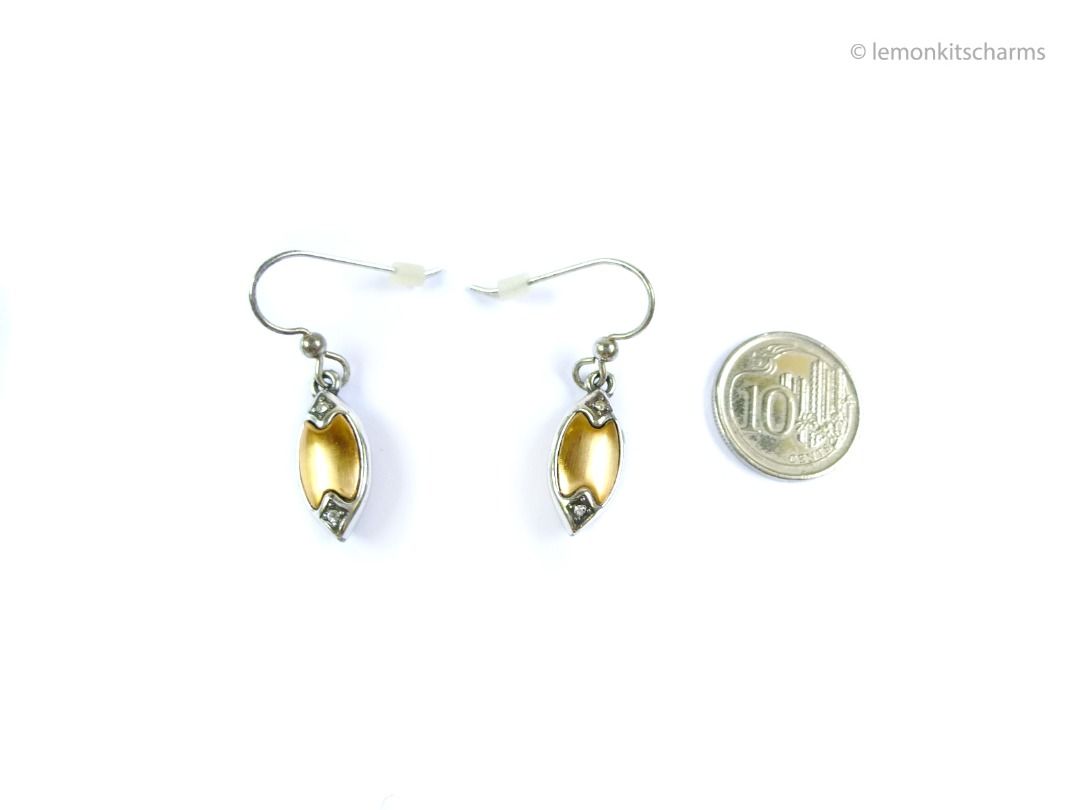 Brighton Two-tone Navette Dangle Earrings, er2668-ci (Category: Earrings) located in Singapore. Submitted by lemonkitscharms (Listing ID 1378138232, Image 3). Description: Brighton Two-tone Navette Dangle Earrings, hooks for pierced ears. Unsigned, not sure how old these are, guessing 1990s - 2000s. Good condition, slight aging and scuffs on surface. Both sides have the same design. Satin finish goldtone middle and silvertone edges. There are 2 r