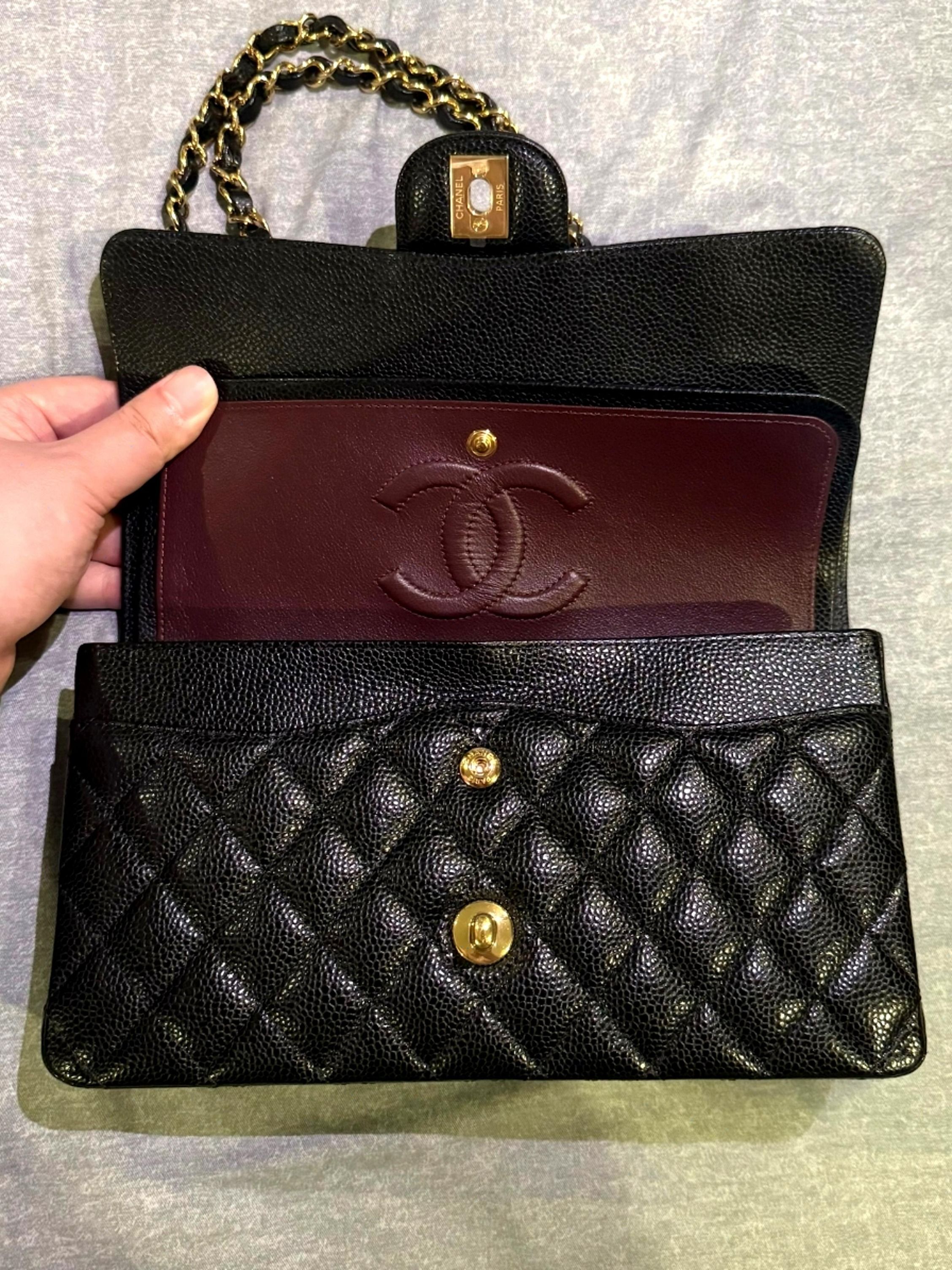 Chanel Caviar Classic Flap Medium CF GHW Full Set (Category: Bags & Wallets) located in Singapore. Submitted by prosperow (Listing ID 1378022628, Image 2). Description: Chanel Classic Flap bag in black caviar leather. Features a gold chain strap and iconic CC turn-lock closure. The interior is lined with burgundy leather. Still in good condition. A timeless piece!.