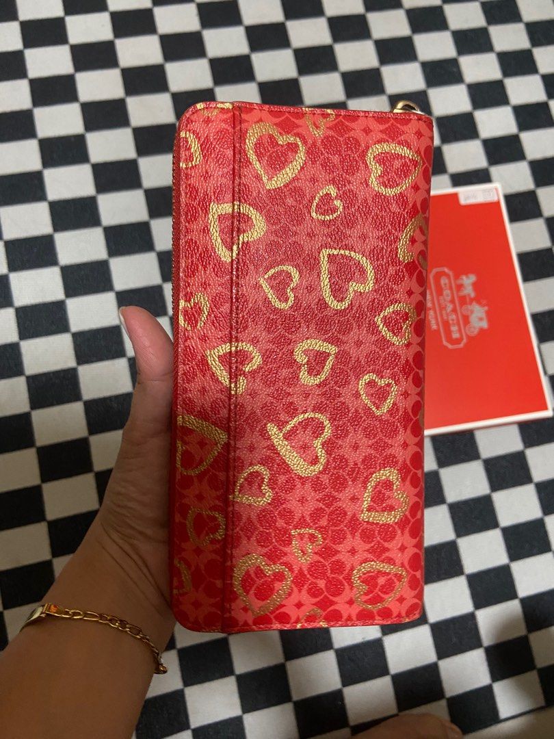 Coach long wallet red hearts (Category: Luxury Bags & Wallets) located in Taguig. Submitted by syyyt16 (Listing ID 1378086505, Image 1). Description: No rubs or peeling .