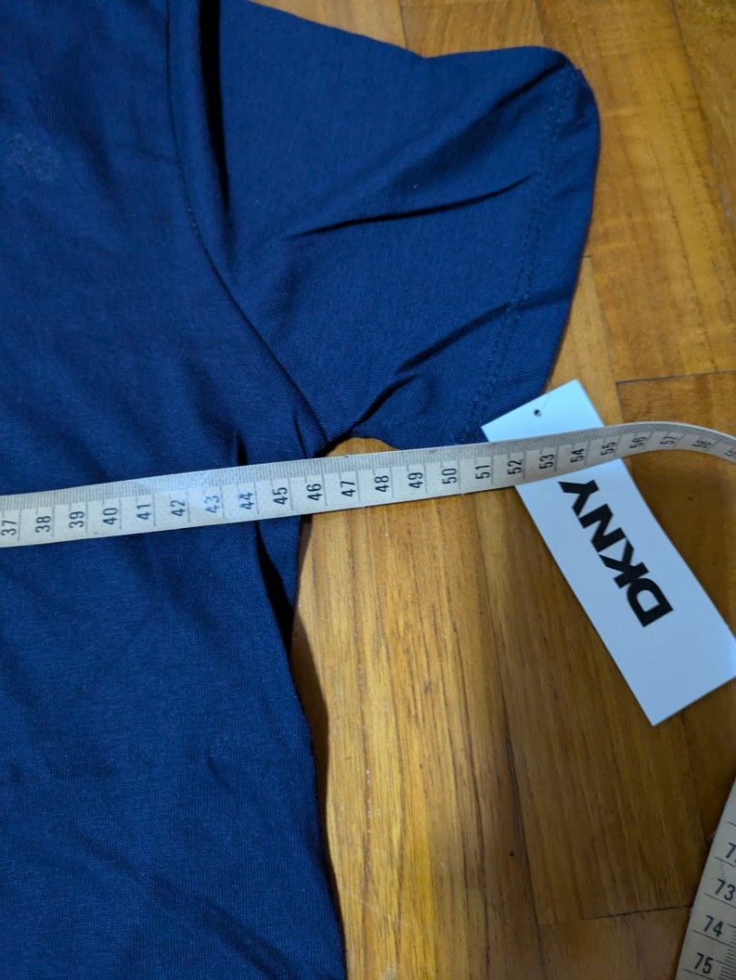 DKNY Boys T-Shirt - Navy Blue L size (Category: Babies & Kids Fashion) located in Singapore. Submitted by ezfastdeals (Listing ID 1378108573, Image 2). Description: - Brand new DKNY boys t-shirt - Color: Navy blue - Features a bold DKNY New York graphic - Made from a comfortable cotton-polyester blend - Perfect for casual wear - Size indicated on tag.
