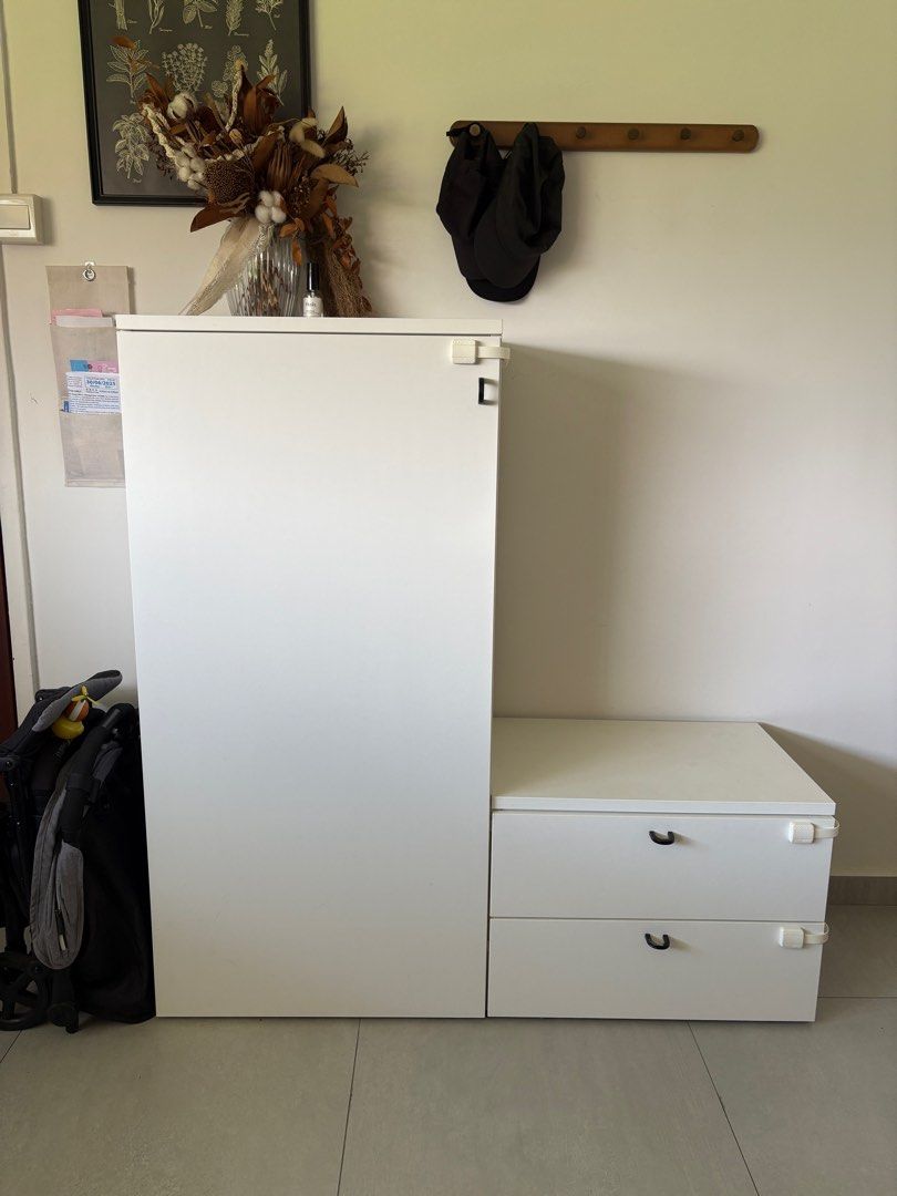 IKEA shoe cabinet with storage bench (white) (Category: Shelves, Cabinets & Racks) located in Singapore. Submitted by nyqrie (Listing ID 1377996700, Image 1). Description: - White IKEA shoe cabinet with compartments for shoes & miscellaneous items. - Comes attached with a sturdy shoe bench storage containing 2 drawers - Generously sized, versatile design - Some minor wear and tear (example of some scuffs & marks in photos), but overall in good co