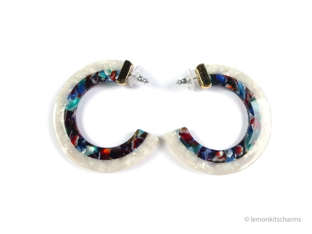Large White Rainbow C-hoop Pierced Earrings, er2662-ci (Category: Earrings) located in Singapore. Submitted by lemonkitscharms (Listing ID 1378078001, Image 1). Description: Large White & Rainbow C-hoop Earrings, for pierced ears. Clutches are new. I think these are modern. The plastic parts are in good condition. The top caps have wear on the plating (see pics), the dot there is a clear rhinestone. Hoops are shimmery white and tortoise-like styl
