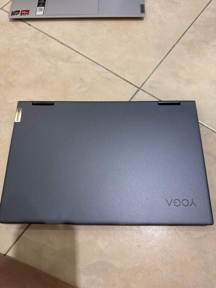 Lenovo Yoga 7 14ACN6 2-in-1 Laptop Ryzen 5800h /16 gb/512 ssd/ touch screen (Category: Laptops & Notebooks) located in Singapore. Submitted by mkdlc (Listing ID 1378109398, Image 2). Description: Lenovo Yoga 7 14ACN6 2-in-1 laptop. Features a sleek grey design and a touchscreen display. It is running Windows 11. The laptop is in good working condition. Includes the original charger..