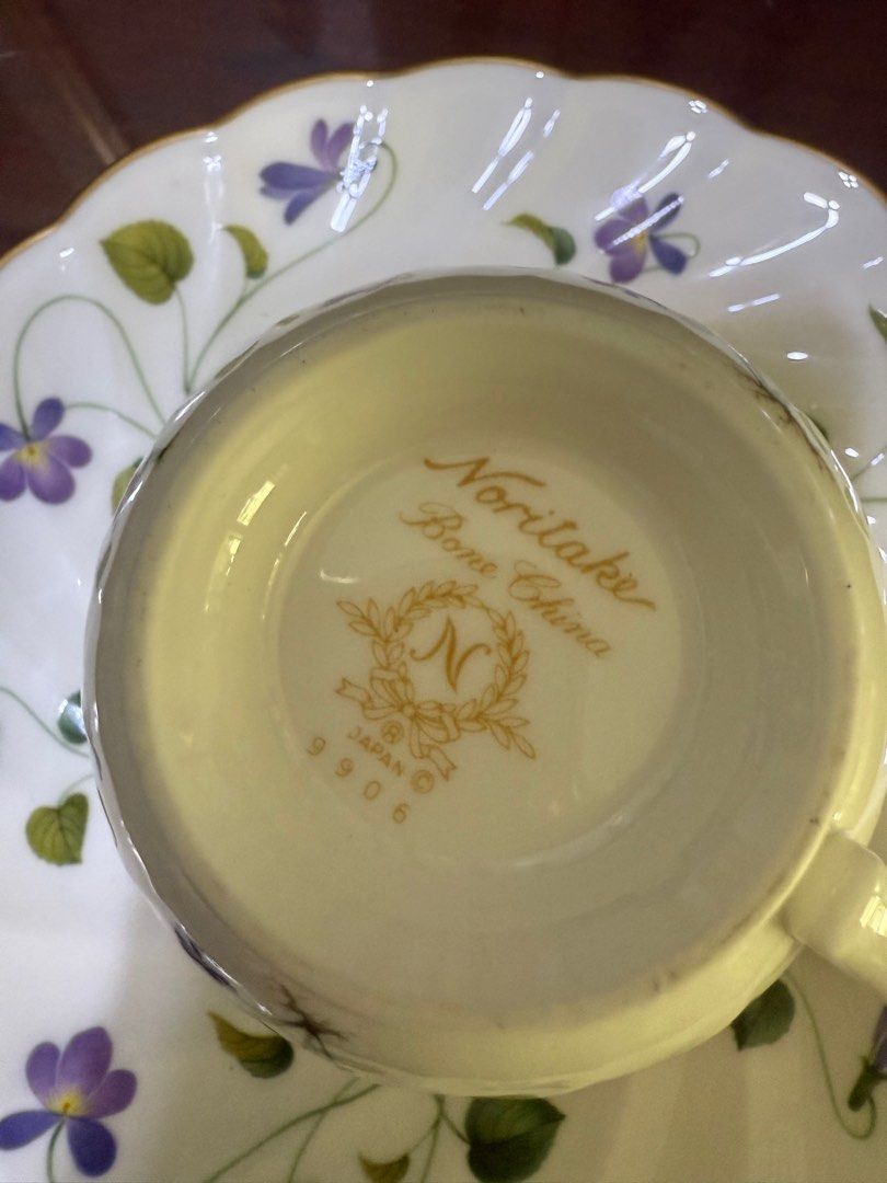 Noritake Violet Dream 9906 Cup & Saucer (Category: Coffee & Tea Tableware) located in Manila. Submitted by goldenfalcon_75c81b (Listing ID 1377967982, Image 3). Description: Noritake Bone China Cup and Saucer set, likely vintage, featuring a purple pansy or violet floral design with gold trim. .