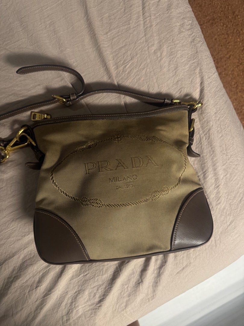 Prada Logo Jacquard Beige Brown Canvas Shoulder Bag (Category: Luxury Bags & Wallets) located in Cabanatuan. Submitted by amirdecluttersph (Listing ID 1377962136, Image 2). Description: 100% Authentic Comes with dust bag and aunthenticity card Bought this at don quijote tokyo store Price is still negotiable Rfs: di na nagagamit .