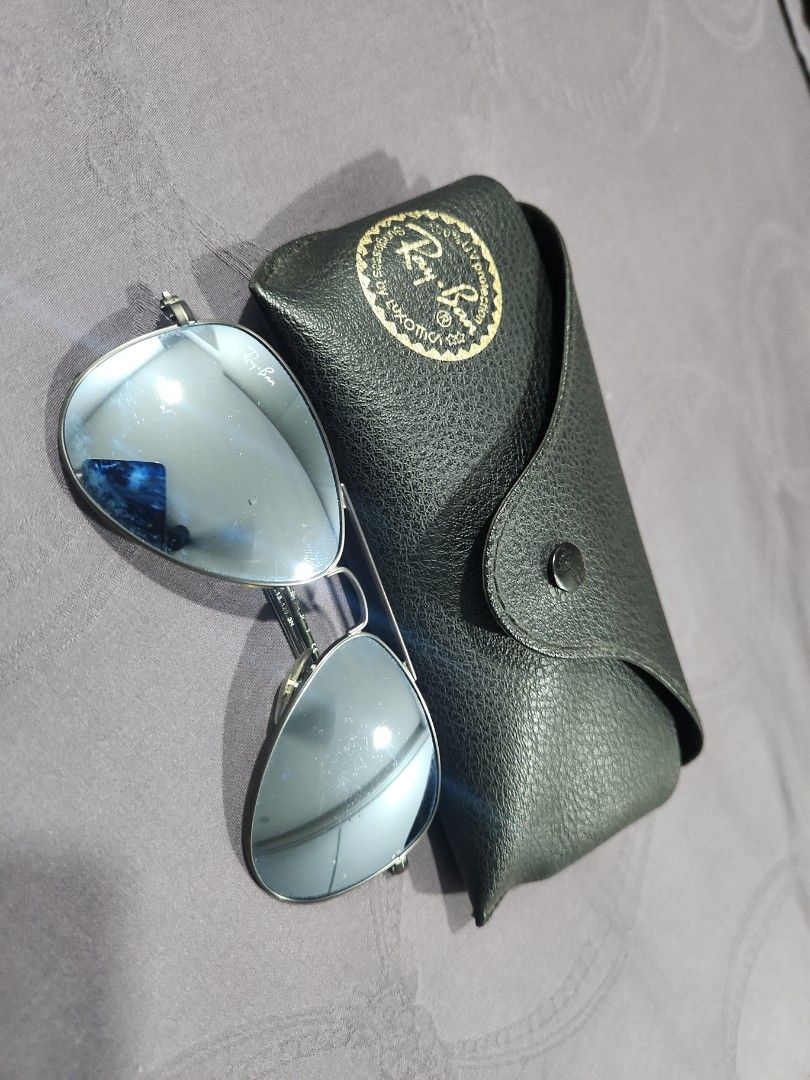 Ray-Ban Aviator Sunglasses - Silver Frame (Category: Babies & Kids Fashion) located in Singapore. Submitted by jenn381 (Listing ID 1378096533, Image 1). Description: - Authentic Ray-Ban Aviator sunglasses - Silver frame - Lenses in excellent condition - Includes original case - Includes cleaning cloth - Includes documentation - Perfect for everyday use.