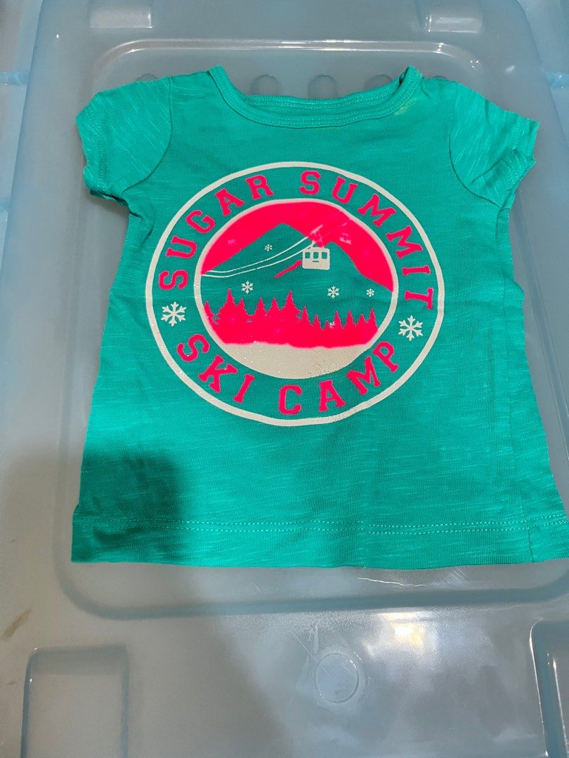 Sugar Summit Ski Camp T-shirt - 3 Months (Category: Babies & Kids Fashion) located in Singapore. Submitted by piyojo (Listing ID 1377972486, Image 1). Description: Adorable Carter's t-shirt featuring a fun 'Sugar Summit Ski Camp' graphic. The shirt is a vibrant teal color. It is in good condition, with some minor discoloration near the collar and behind shirt. Perfect for your little one! Can meet up and sight the shirt before release cash paymen