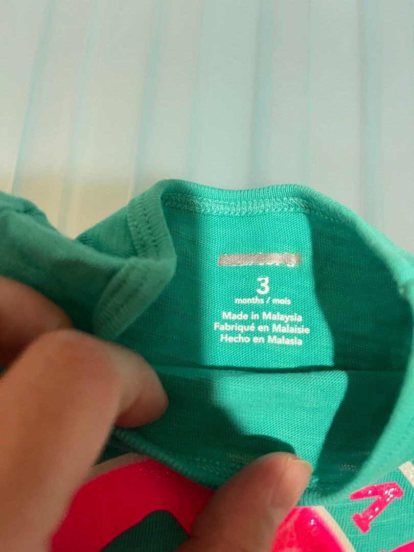 Sugar Summit Ski Camp T-shirt - 3 Months (Category: Babies & Kids Fashion) located in Singapore. Submitted by piyojo (Listing ID 1377972486, Image 3). Description: Adorable Carter's t-shirt featuring a fun 'Sugar Summit Ski Camp' graphic. The shirt is a vibrant teal color. It is in good condition, with some minor discoloration near the collar and behind shirt. Perfect for your little one! Can meet up and sight the shirt before release cash paymen