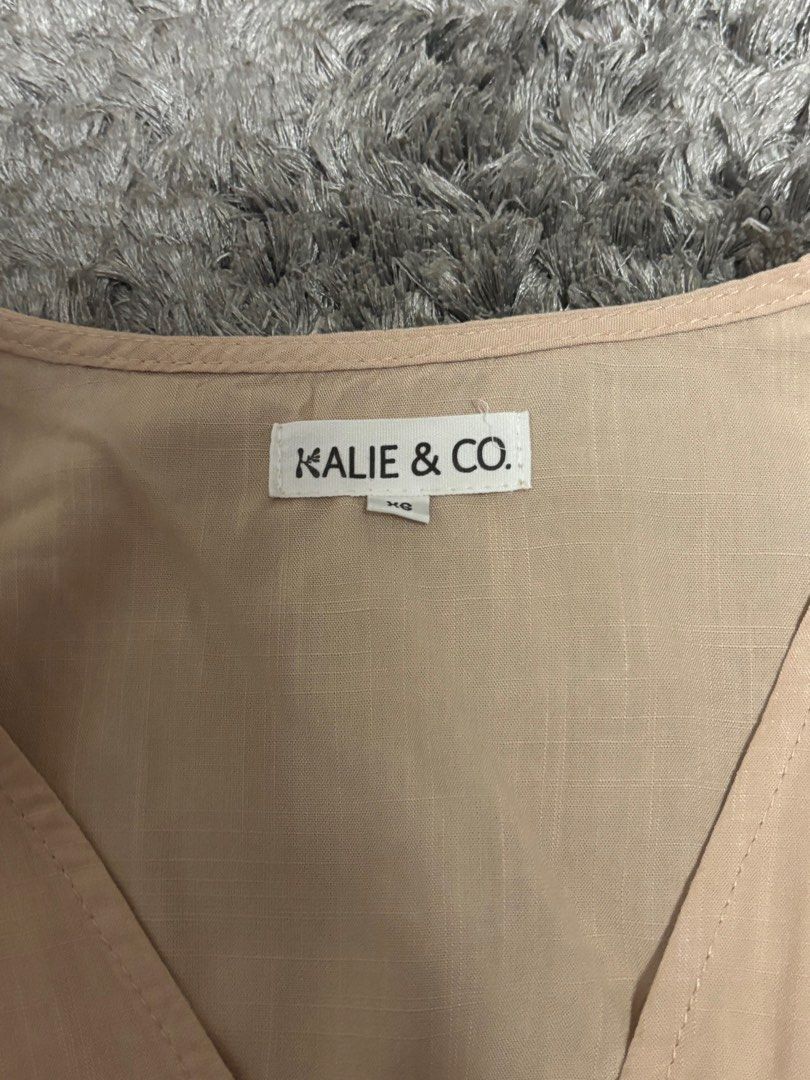 Tie top v-neck from Kalie & Co. (Category: Sleeveless) located in Manila. Submitted by pauly2112 (Listing ID 1378062555, Image 3). Description: Beige tie/ribbon top from local ph brand Kalie & Co. Unused, originally sold for 1495php rfs: doesn’t fit/decluttering flaws: none m.o.p.: Gcash delivery: Lalamove (buyer will shoulder sf).