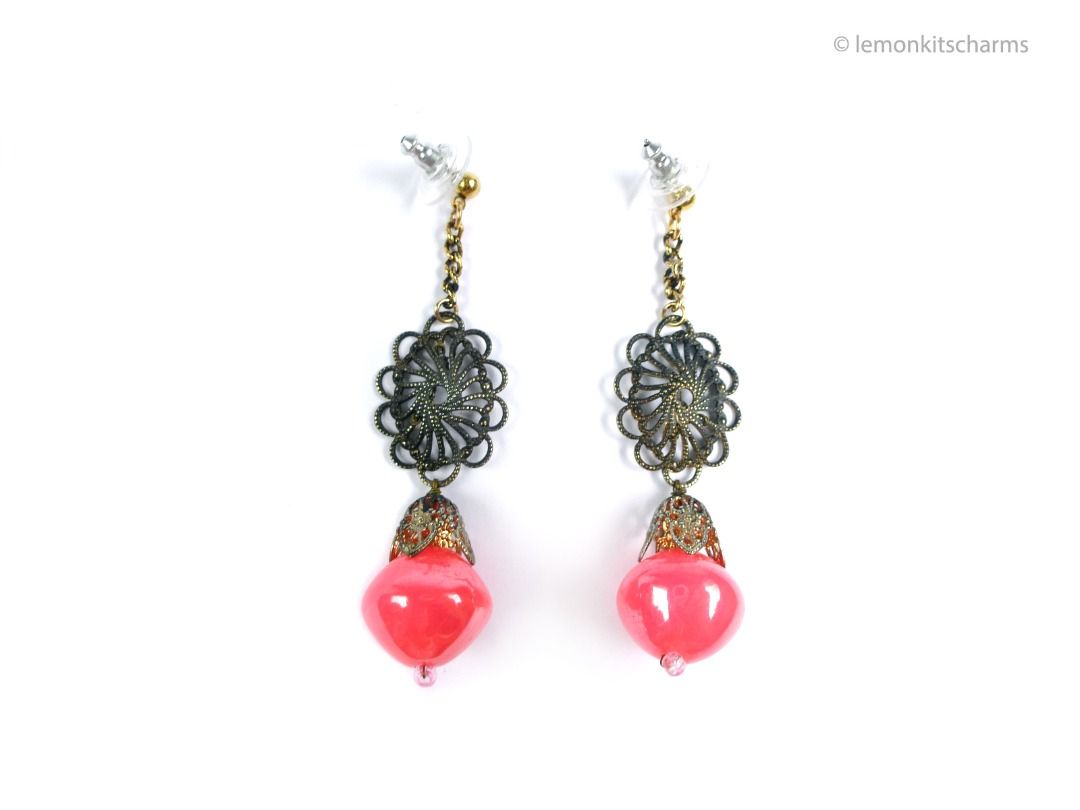 Vintage 1960s Neon Pink Dangle Pierced Earrings, er2661-ci (Category: Earrings) located in Singapore. Submitted by lemonkitscharms (Listing ID 1378077630, Image 1). Description: Vintage 1960s Neon Pink Dangle Earrings, the top pierced posts and clutches are new old vintage stock (these were originally on clips). Very good condition. Ox-brass filigree with wired dangle made of laminated neon pink plastic beads. There is an antiqued-goldtone chain 