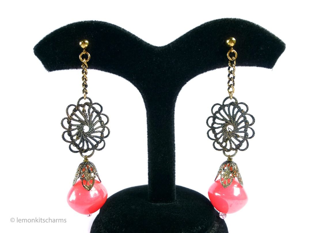 Vintage 1960s Neon Pink Dangle Pierced Earrings, er2661-ci (Category: Earrings) located in Singapore. Submitted by lemonkitscharms (Listing ID 1378077630, Image 2). Description: Vintage 1960s Neon Pink Dangle Earrings, the top pierced posts and clutches are new old vintage stock (these were originally on clips). Very good condition. Ox-brass filigree with wired dangle made of laminated neon pink plastic beads. There is an antiqued-goldtone chain 