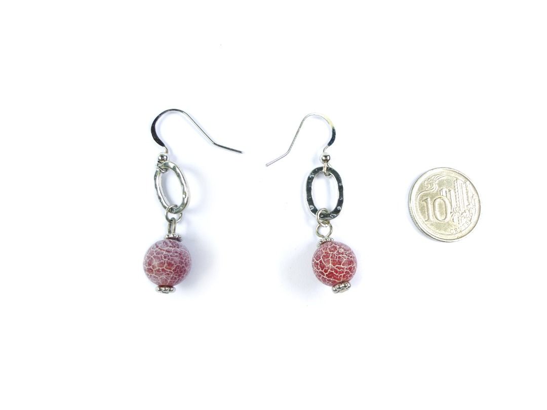 Vintage 1990s Red Crackled Glass Dangling Earrings, er2667-ci (Category: Earrings) located in Singapore. Submitted by lemonkitscharms (Listing ID 1378138153, Image 3). Description: Vintage 1990s - Y2K Red Crackled Glass Dangle Earrings, for pierced ears. Good condition, slight copper base showing on one of the hooks and the loops from wear. Silvertone with oval hammered metal ring, and what looks to be a glass bead with a white crackled effect. P