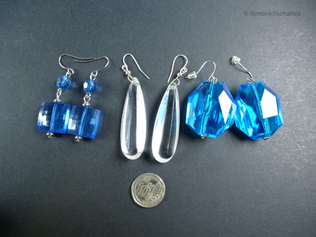 Vintage Blue & Clear Plastic Lucite Pierced Earrings 3pc, er2664-ci (Category: Earrings) located in Singapore. Submitted by lemonkitscharms (Listing ID 1378079108, Image 3). Description: Vintage 1990s - Y2K Blue & Clear Plastic Lucite Earrings, sellling as a lot. All hooks for pierced ears. The blue square one has crackle lines within and dulling on surface. The clear drop ones have dulling & scuffs on surface but still nice when worn. The chunky