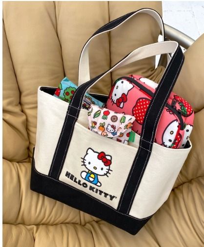 Baggu X Hello Kitty small heavyweight canvas bag (Category: Tote Bags) located in Quezon City. Submitted by oli_g (Listing ID 1379830704, Image 2). Description: Size: 24cm × 39cm × 15cm Materials: 100% cotton canvas - A quintessential and versatile tote, perfectly sized to carry in hand or over the shoulder. - Nice thick canvas that's easy to clean - Exterior front pocket - 10" top carry handles - Two handles and 101cm adjustable strap - Can carr
