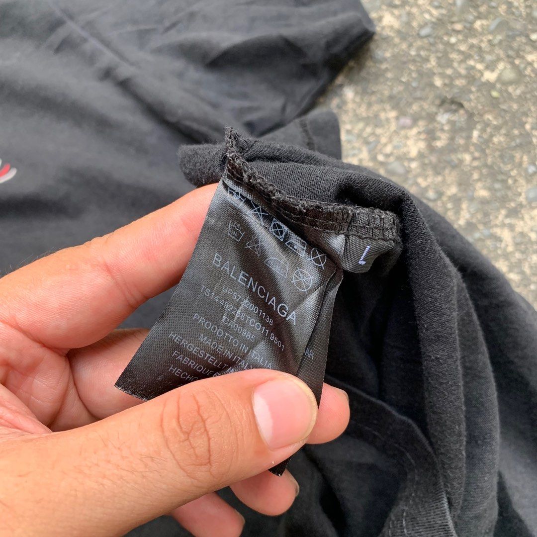 BALENCIAGA WAVE SHIRT (Category: Luxury Apparel) located in Manila. Submitted by rarefindslt (Listing ID 1379725535, Image 3). Description: BALENCIAGA WAVE SHIRT (SWIPE LEFT FOR MORE DETAILS..) L on tag (fits to M-L womens) can pass as good condition rate, 8.5 color rate, with tags but unsure if legit or fake, solid front and back hit print design, no other issue.