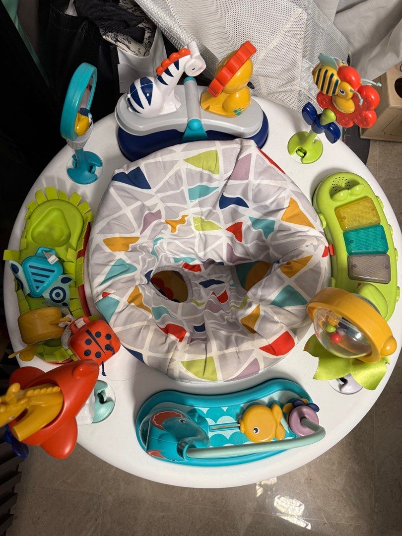Fisher-Price 3-in-1 Activity Centre (Category: Infant Playtime) located in Singapore. Submitted by highonhouse (Listing ID 1379901557, Image 2). Description: This Fisher-Price activity center offers multiple ways to play! It features a variety of toys and activities to keep your baby entertained. The seat rotates, allowing baby to explore all the fun features. It's in great condition and ready for a new home!.