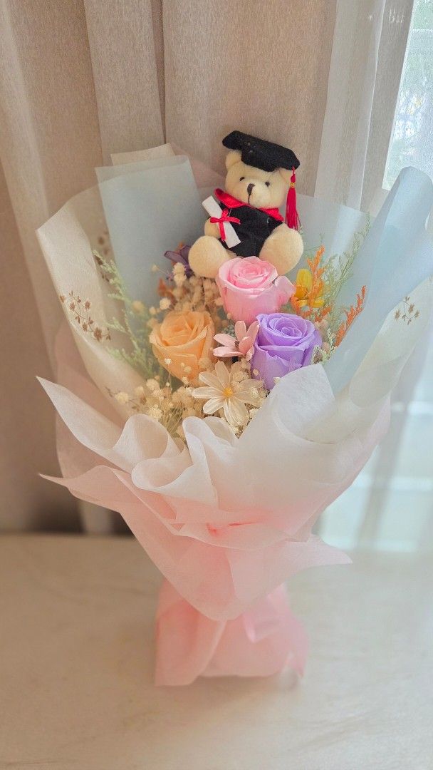 Graduation bouquet- preserved flowers (Category: Flowers & Bouquets) located in Singapore. Submitted by prettyflowers (Listing ID 1379756671, Image 2). Description: Graduation bouquet up for grab! Celebrate their achievements with beautiful graduation bouquet! Dimension 35cm x 55cm #Graduationbouquet #preservedroses #preservedflowersbouquet.