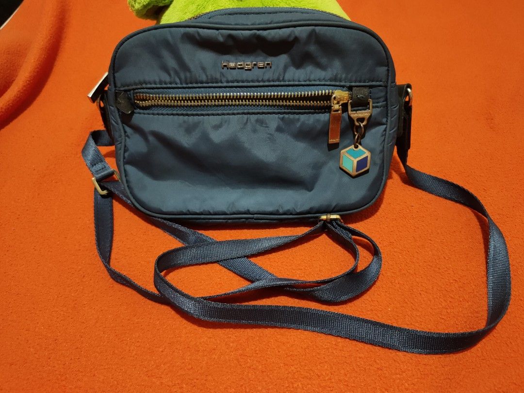 Hedgren Authentic Mini Crossbody Bag (Category: Cross-body Bags) located in Quezon City. Submitted by jhaneth21 (Listing ID 1379887427, Image 1). Description: For Phone Wallet Keys, & Small Essentials 2 Zip Compartments Puller and Hardware Logo with Original Key Chain with Logo Gold Hardware Lightweight Size: 8" x 5.5" x 1.5".