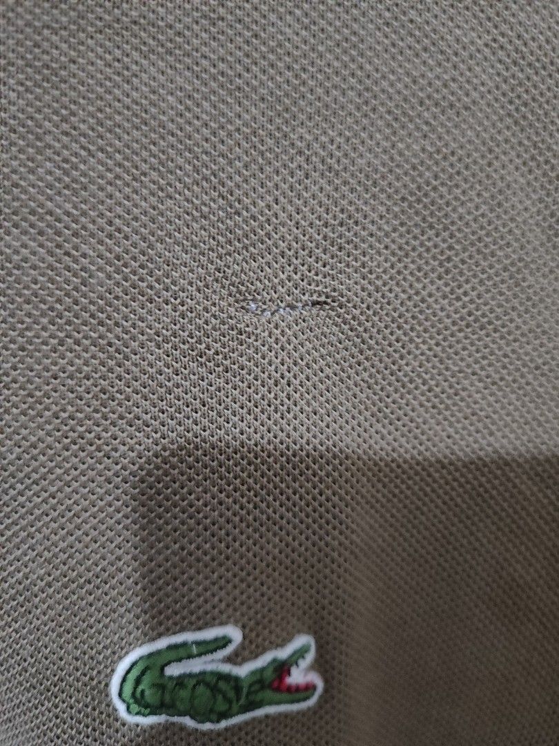 Lacoste Brown Polo Shirt (Category: Tshirts & Polo Shirts ) located in Manila. Submitted by ksayson (Listing ID 1379722831, Image 3). Description: Dimes: 21x28.5 Size on Tag: Size 5 Color Rate; 9/10 Issue: Restitch, fake Price: 150 Location: Manila Decluterring.