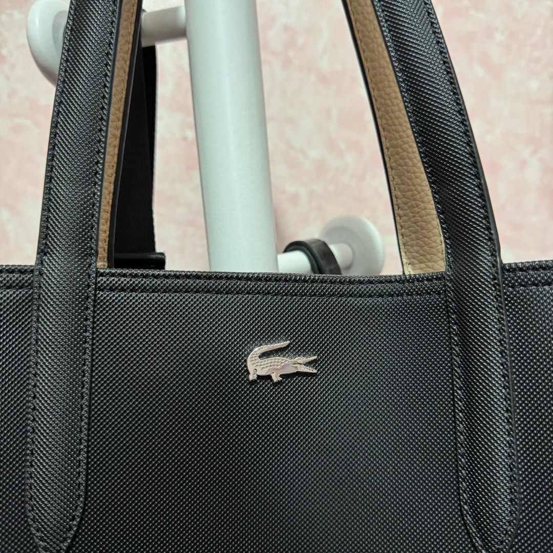 Lacoste Reversible Tote Bag (Black/Cream) (Category: Tote Bags) located in Imus. Submitted by esioul15 (Listing ID 1379862560, Image 3). Description: ‼️ NO TO LOWBALLERS ‼️ - issue: slight bent on the handles - used only for a few times - bought for ₱6950 (see tag in the 8th photo) mop: gcash .