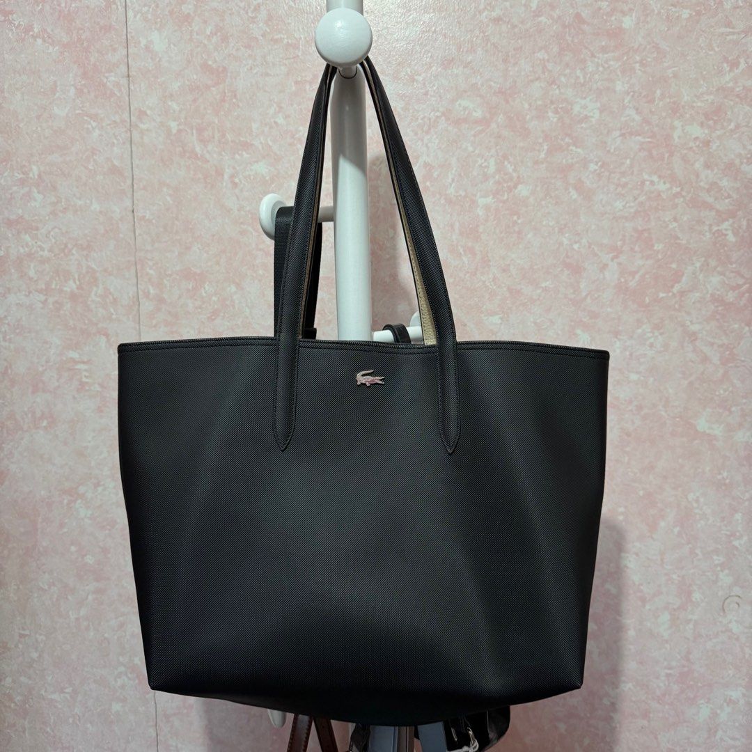 Lacoste Reversible Tote Bag (Black/Cream) (Category: Tote Bags) located in Imus. Submitted by esioul15 (Listing ID 1379862560, Image 1). Description: ‼️ NO TO LOWBALLERS ‼️ - issue: slight bent on the handles - used only for a few times - bought for ₱6950 (see tag in the 8th photo) mop: gcash .
