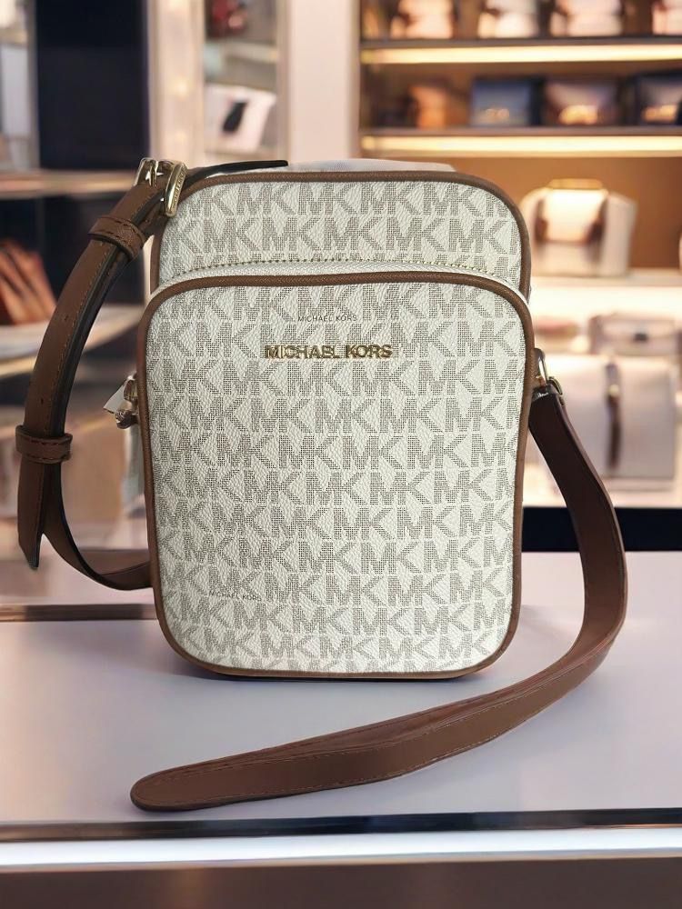 MK Michael Kors Jet set charm crossbody sling bag (Category: Bags & Wallets) located in Singapore. Submitted by fascinating.premium.bag.mall (Listing ID 1379897218, Image 1). Description: MK's new JetSet series of single-shoulder crossbody bags and mobile phone bags are unisex. The monogram brings the summer trend. The double-layered full bag capacity is super practical. Medium size: 15 cm X 7cmx20cm.