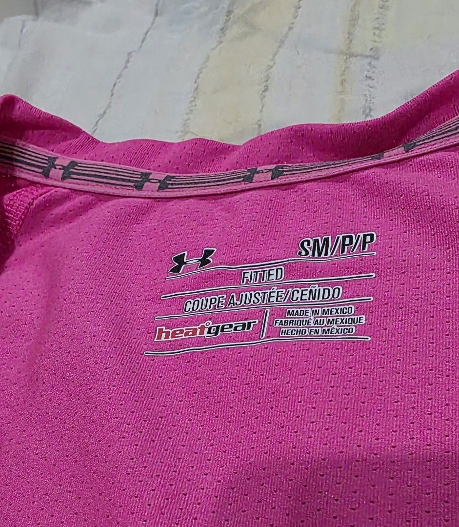 Original Under Armour Hot Pink Active Shirt (Category: Activewear) located in San Juan City. Submitted by caragig (Listing ID 1379886010, Image 2). Description: Brand: Under Armour original Color: Hot Pink Size: Small Type: active wear, heat gear model, sweat evaporates quickly Design: v-neck, slim fit Condition: lightly used, still in very good condition, color is still vibrant, logo is not yet faded Measurement: Chest: 17. 5 inches Waist: 17. 7