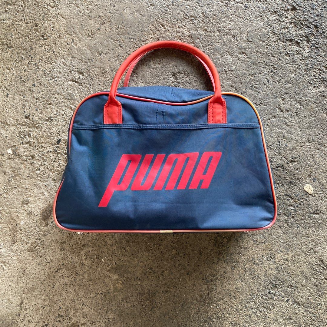 Vintage Puma Duffle Bag (Category: Luxury Bags & Wallets) located in Santa Barbara. Submitted by evrysundayvintage (Listing ID 1379784935, Image 1). Description: Vintage Puma Duffle Bag Good condition Signs of usage Fadings on handle & silicon lining .