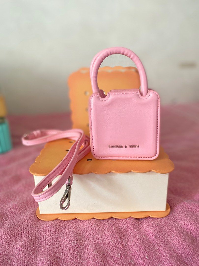 Charles and Keith Micro Perline (Category: Purses & Pouches) located in Rizal. Submitted by 17.righthere (Listing ID 1379955927, Image 3). Description: C&K Micro Perline Sculptural Bag Never been used, tnitigan and keep lng s box 😅 With strap, dust bag, cookie box and tags Available in pink and matcha green.