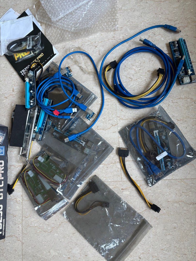 Crypto mining stuff (Category: Computer Parts) located in Singapore. Submitted by thebarney (Listing ID 1380085588, Image 3). Description: gave up mining a few years ago not sure if mobo still working but those pci items in plastic are still new. Selling all as package or trade if you have philodendron or phal. plants.