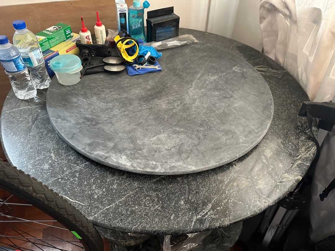 Marble Dining Table with Lazy Susan (Category: Tables & Sets) located in Singapore. Submitted by izzx11 (Listing ID 1379981971, Image 1). Description: Elegant marble dining table with a lazy susan. The table is supported by a marble stand. The table shows signs of use, but is structurally sound. Can be placed in gardens. Pick up only. Collect from amk Please arrange own transport and dismantling of the table..