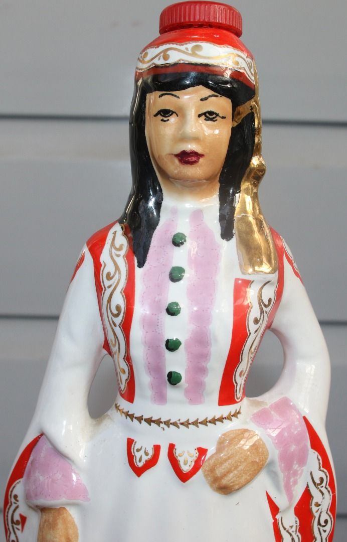 Preloved Vintage Hand-Painted Ceramic Metaxa Bottle, Female Figurine (Category: Kitchen & Appliances) located in Burnie. Submitted by tasmanianbeauties (Listing ID 1380093143, Image 1). Description: Preloved Vintage Hand-Painted Ceramic Metaxa Bottle, Female Figurine This decanter stands 32cm tall and has base measurements of 9.2cm x 7.8cm. It is empty. It is made in Greece It has no chips or cracks, and the pattern is well preserved. It has a st