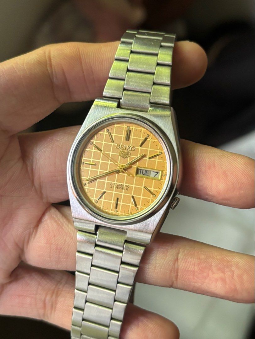 Vintage Seiko 5 Grid Dial Automatic Wrist Watch (Category: Men's Watches) located in Marikina City. Submitted by marceljdo (Listing ID 1379949389, Image 2). Description: Seiko 5 Golden Grid Dial Vintage Watch JDM Very Good Condition ++ English / Arab Day Date 7009 - 7S26 transition rare model 1980’s vibe! GCash. / BankTransfer / Lalamove .