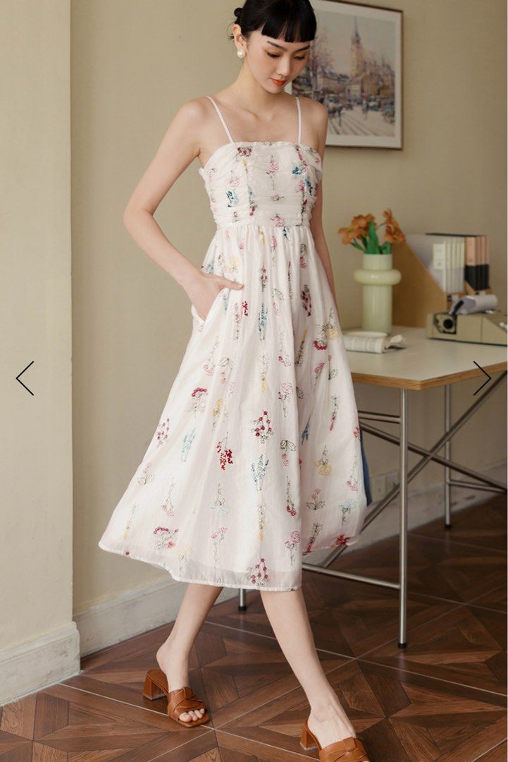 BNWT Arielle Embroidery Tencel Midi Dress (Category: Dresses) located in Singapore. Submitted by cloudysky30 (Listing ID 1380214277, Image 3). Description: Made of tencel blend. Features multi-colour florals embroidered on fabric. Gathered ruches and paneling details at chest and back. Non-detachable bandeau padding at chest. Anti-slip silicon around bust line front and back. Adjustable shoulder straps. Concealed back zip. Functional side pockets