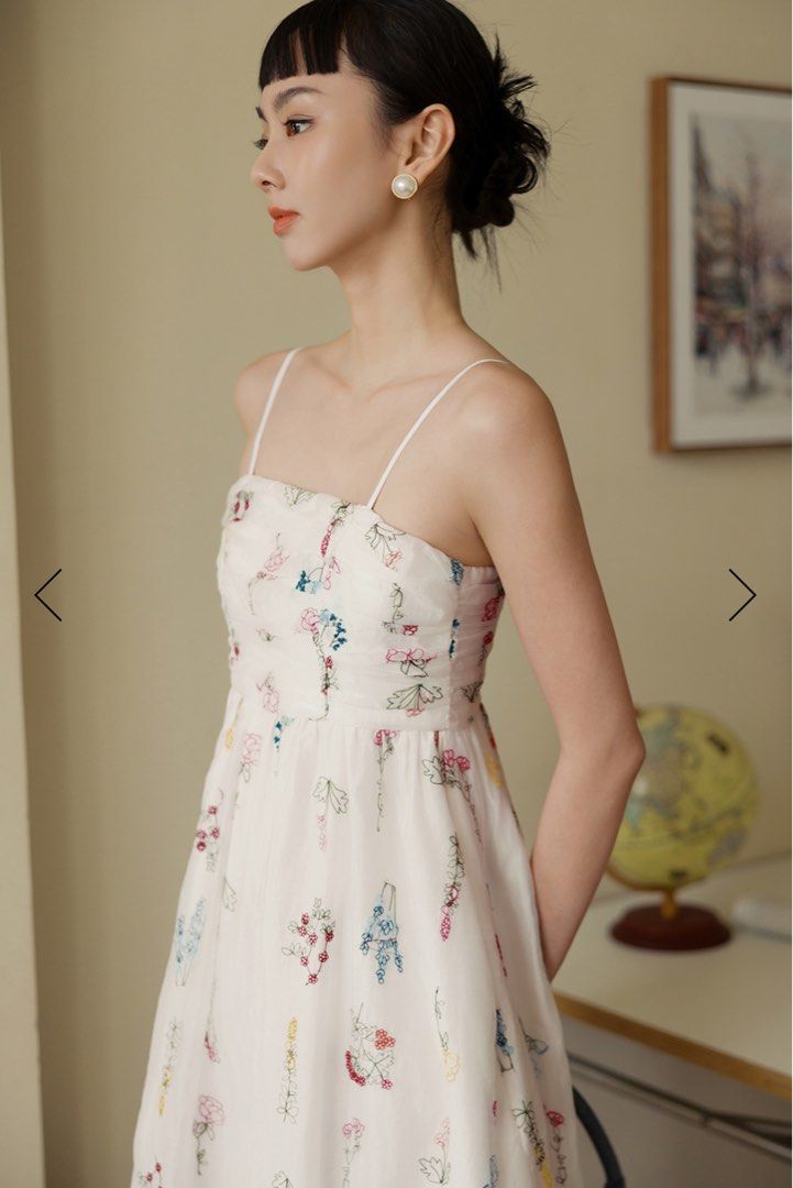 BNWT Arielle Embroidery Tencel Midi Dress (Category: Dresses) located in Singapore. Submitted by cloudysky30 (Listing ID 1380214277, Image 1). Description: Made of tencel blend. Features multi-colour florals embroidered on fabric. Gathered ruches and paneling details at chest and back. Non-detachable bandeau padding at chest. Anti-slip silicon around bust line front and back. Adjustable shoulder straps. Concealed back zip. Functional side pockets