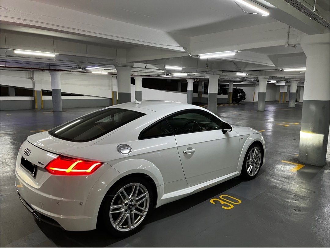 Audi TT Coupe 2.0 TFSI S tronic (A) (Category: Used Cars) located in Singapore. Submitted by bbf30 (Listing ID 1380166561, Image 3). Description: With fresh 10 years COE, massive savings from new! Extremely rare high spec Quattro unit with original factory S-Line trim and body kit. Perfect colour combo of glacier white with nougat brown nappa leather interior. Full Audi service records. No expense spared maintenance with receipts to prove. Probab