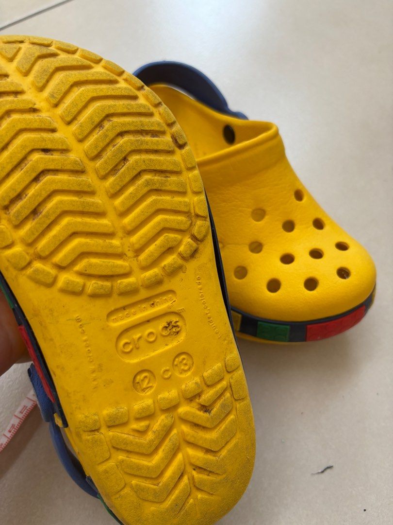 Authentic Crocs Lego (Category: Babies & Kids Fashion) located in Cebu City. Submitted by happyheartcebu (Listing ID 1380167647, Image 2). Description: Authentic and Original Crocs Lego design Size 21.5cm Damaged side design but can use mighty bond to stick it back.