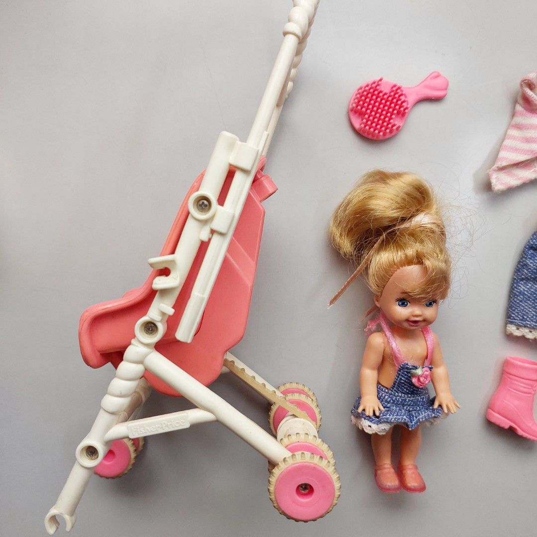 Barbie 90s Kelly Strollin Fun (Category: Kids Toys) located in San Juan City. Submitted by peachykr (Listing ID 1380161025, Image 2). Description: Barbie - Kelly - Strollin' Fun Toys from the 90s. Kelly's back has a mechanism to make her wave. This can be moved manually or when the stroller is pushed while she sits down on it. Stroller is missing one wheel and other parts. Will need some fix to fully function. Please expect typical wear and tear.