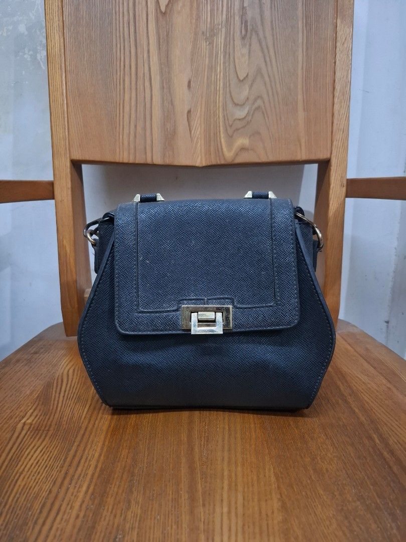 Black bag (both body and purse bag) (Category: Cross-body Bags) located in Quezon City. Submitted by wise_r (Listing ID 1380127036, Image 1). Description: PM if interested Bag: 1. Black bag 2. Big space inside and can hold a lot of items. 3. The bag is very sturdy, and has a tire-like skin exterior. Defects: 1. The strap hook, but nothing that cannot be replaced. 2. Some metal accents are fading but not rusting and can be polished. Reminder: - Th