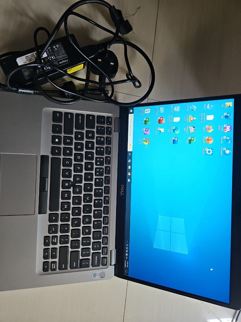 Dell Laptop - Silver (Category: Laptops & Notebooks) located in Singapore. Submitted by ivalueshopsg (Listing ID 1379021003, Image 2). Description: - Excellent condition Dell laptop - Sleek silver design - Multiple ports for connectivity - Vibrant screen display - Keyboard and trackpad in great shape - Ready for immediate use 6 Months Used.