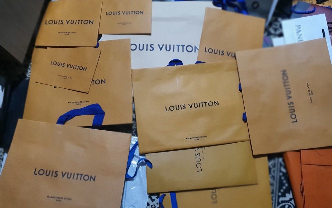 Louis Vuitton Paper Bags - Various Sizes (Category: Accessories) located in Singapore. Submitted by gundhufart (Listing ID 1380284105, Image 1). Description: Authentic Louis Vuitton paper bags in various sizes. Perfect for gifting or collecting. Bags are in good condition, some with blue ribbon handles. Price is for everything in the pic. Not individually..