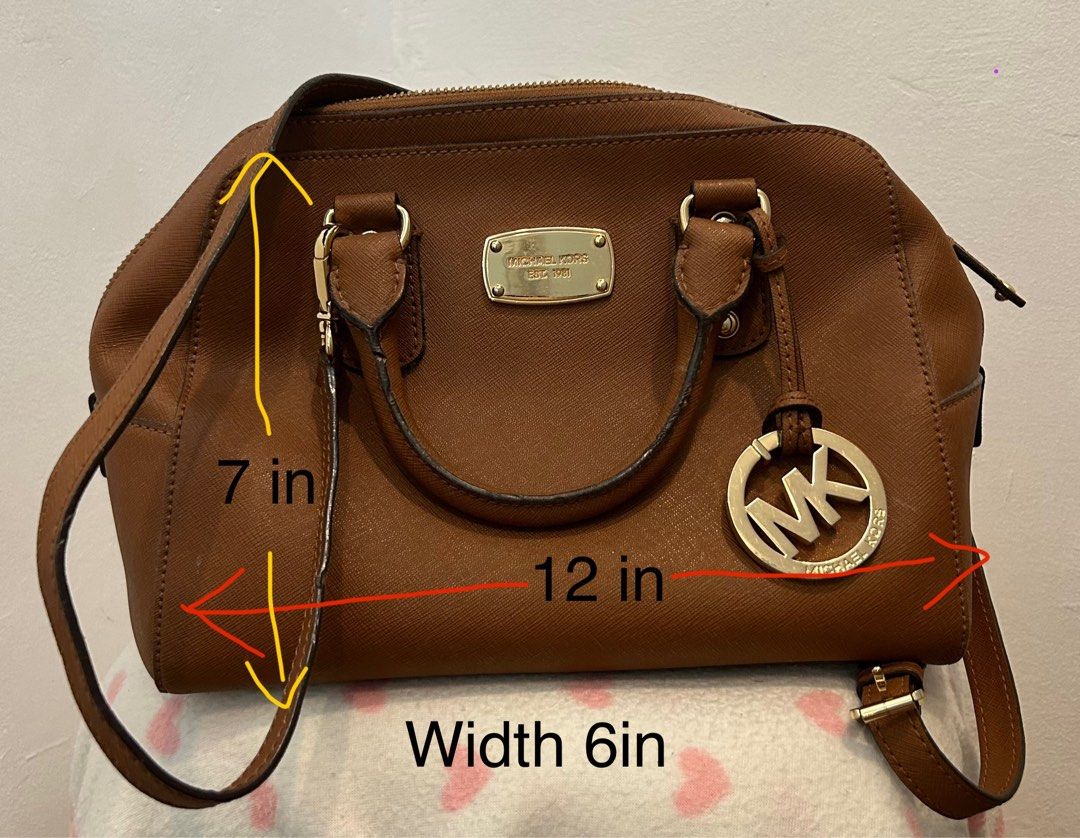 Michael Kors Satchel (Category: Luxury Bags & Wallets) located in Muntinlupa City. Submitted by Izza_MD (Listing ID 1380187213, Image 2). Description: Michael Kors satchel on saffiano leather. Bought in UK. Comes with shoulder strap. Price: Php 3000 RFS: Decluttering.